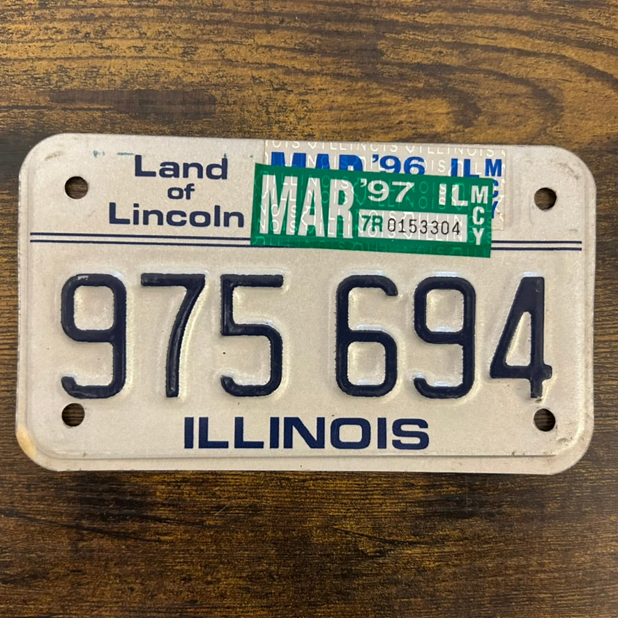975 694